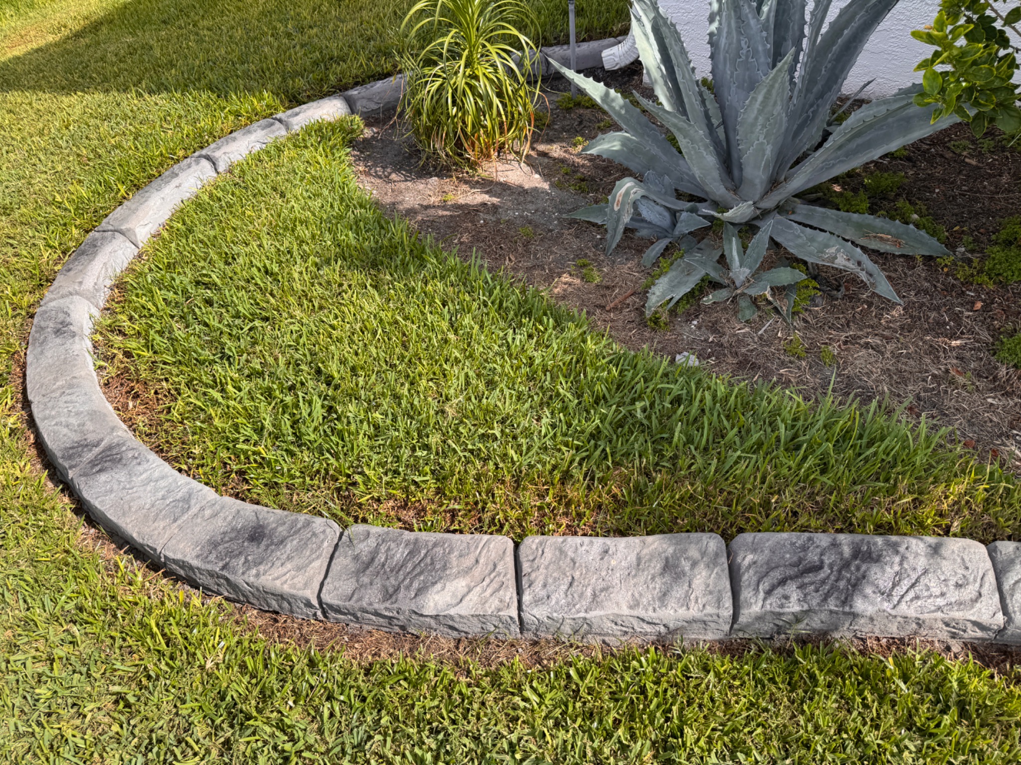 Curved natural-stone landscape border